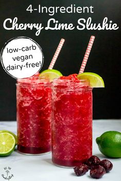 two glasses filled with cranberry lime slushie on top of a table