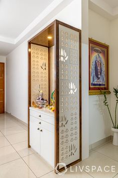 an open door in the middle of a room with white walls and tile flooring