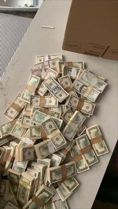 a pile of money sitting on top of a counter