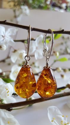 ❤ These beautiful amber drop earrings are made of genuine cognac & green Baltic Amber stones with silver plated details. ❤ Such jewelry is always a perfect gift for every woman and for any occasion. Especially amber stones add luxury and romance to the whole style & make it look more exclusive, because every amber stone is unique. ❤ Earrings with smaller amber diameters - ~ 1.5 x 1 cm (0.67 x 0.32 inches), available colours: light & dark green, lemon, cognac light & cognac dark. ❤ Earrings with Luxury Amber Heirloom Jewelry, Luxury Gold Baltic Amber Jewelry, Luxury Amber Earrings For Anniversary, Luxury Handmade Amber Gemstones, Cheap Amber Beaded Jewelry, Luxury Elegant Amber Necklaces, Teardrop Baltic Amber Earrings, Amber Teardrop Earrings As A Gift, Amber Teardrop Earrings Gift