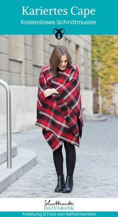 a woman in a red and black plaid ponchle walking down the street with her hands on her hips