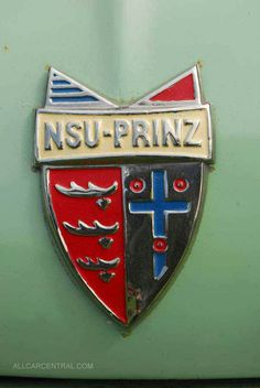 an emblem on the side of a green car that says nsu - priz