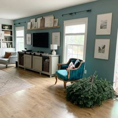 a living room filled with furniture and a flat screen tv