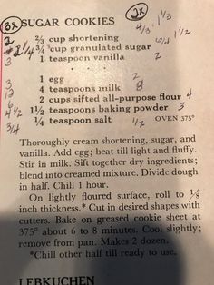 the recipe for sugar cookies is shown on top of a piece of paper with writing