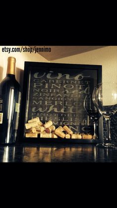 there is a wine glass and corks on the table