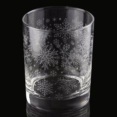 a clear glass with snowflakes on it