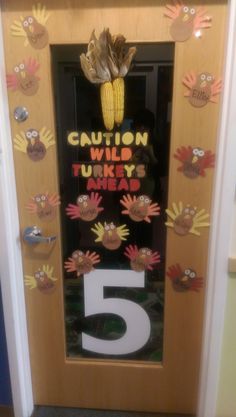 a door decorated with handprints and the number five