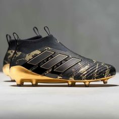 the new adidas predator soccer shoe is designed to look like it has gold and black stripes