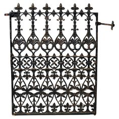 an old iron gate with ornate designs on the top and bottom, isolated against a white background