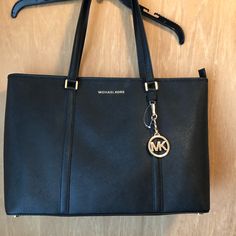 Black Large Michael Kors Tote Bag. Perfect For Carrying A Laptop. Michael Kors Black Shoulder Bag For Business, Michael Kors Black Business Shoulder Bag, Michael Kors Shoulder Bag With Branded Hardware For Business, Michael Kors Business Tote Shoulder Bag, Michael Kors Black Shoulder Bag With Zipper, Michael Kors Black Shoulder Bag With Zipper Closure, Chic Black Michael Kors Bag, Michael Kors Black Satchel Bag, Michael Kors Black Bag With Zipper Closure