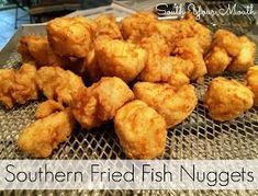 fried fish nuggets are piled up on a wire rack with the words southern fried fish nuggies