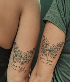 two people with matching tattoos on their arms