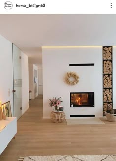 a living room filled with furniture and a fire place next to a wall mounted fireplace