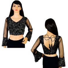 Item Description Beautiful Women's Velvet Sequins V-Neck Net Sleeves Ethnic Designer Blouse Fabric:-Velvet Sequins Color:-Black Sale For:-1 Blouse Closure Type:-Back Hook & Eye With Dori Sleeves Type:-3/4 Sleeves Neck Style:-V-Neck Product:-Padded Blouse With Cotton Inner Lining Care Instructions:-Hand Wash or Dry Clean Only Disclaimer:-The Actual Color Of The Product Slightly Vary From The Image Due To Photographic Light Or Monitor's Display. Measurement Sleeves Length:-21.5 Inch Front Neck Depth :-8 Inch Back Neck Depth :-11.5 Inch Ethnic Sequins Work Velvet Designer Blouse Net Sleeves To Give Yourself A Splendid Traditional Makeover! A Perfect Match For Your Grand Sarees.Pair This Ready To Wear Blouse With Any Type Of Saree In Various Occasions.This Would Be Classy Yet Fashionable Choic Traditional V-neck Sharara For Party, Bollywood V-neck Sets With Sequins, Festive V-neck Georgette Blouse Piece, Fitted V-neck Blouse With Mirror Work, Festive Georgette V-neck Blouse Piece, Semi-stitched V-neck Saree For Party, Party V-neck Traditional Wear With Zari Work, Traditional V-neck Party Sets, Diwali V-neck Blouse With Mirror Work