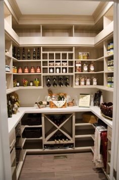 an open pantry with lots of bottles on the shelves