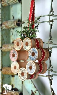 an assortment of wooden spools hanging from a wire