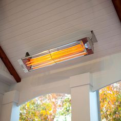 an air conditioner sitting on top of a window sill