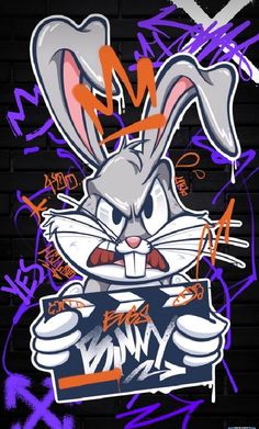 graffiti on the side of a building with an angry bunny holding a sign in front of it