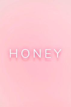 the word honey written in neon pink against a light pink background with white letters on it