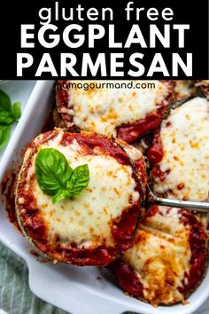 an eggplant parmesan in a white casserole dish with basil on top