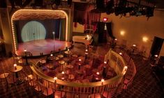 an overhead view of a stage with many chairs and candles on the floor in front of it