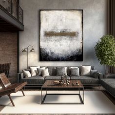 a living room filled with furniture and a large painting on the wall above it's coffee table