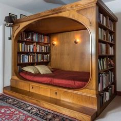 a bed built into the side of a book shelf