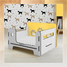 a child's bed with a dog themed wallpaper behind it