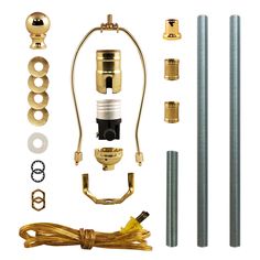 an assortment of brass fittings and accessories for a water heater with hoses