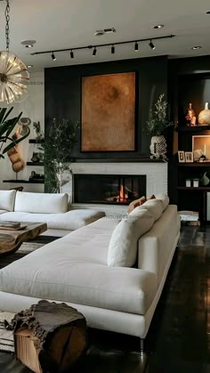 a living room filled with furniture and a fire place in the middle of the room