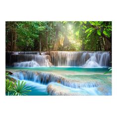 a waterfall in the jungle with blue water