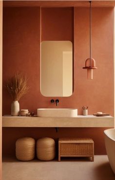 a bathroom with a sink, mirror and bathtub