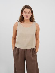 "CALI is a sleeveless tank top with scoop neckline and relaxed fit. DETAILS - Scoop neck - Sleeveless design - Straight cut - Oeko-Tex certified 100% local washed midweight linen - Cut and sewn to order just for you in our studio COLOR - Beige, you can also choose other colors above - Fabric samples are available here https://www.etsy.com/listing/586569696/linen-fabric-samples SIZING & FIT - Fits true to size - Model is 5'6\" / 172 cm and wearing a size M CARE FOR LINEN - Machine wash up to 30ºC/86ºF gentle cycle - Lay flat to dry or tumble dry low - Warm iron if needed - Do not bleach SIZE GUIDE Size conversion guide Size XS (US 0-2, IT 36-38, UK 4-6, Japan 3-5, France 32-34) Size S (US 4-6, IT 40-42, UK 8-10, Japan 7-9, France 36-38) Size M (US 8-10, IT 44-46, UK 12-14, Japan 11-13, Fran Casual Scoop Back Tank Top For Spring, Casual Cotton Tank Top With Scoop Back, Basic Sleeveless Crop Top For Everyday, Spring Relaxed Fit Scoop Neck Tank Top, Summer Cotton Camisole With Scoop Back, Summer Cotton Scoop Back Camisole, Relaxed Fit Scoop Neck Crop Top For Summer, Casual Everyday Top With Scoop Back, Casual Tops With Scoop Back For Everyday