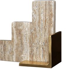 a set of three marble bookshelves sitting on top of each other