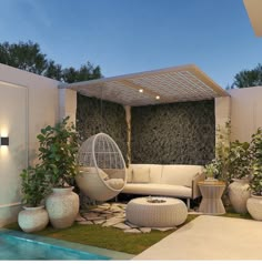 an outdoor living area with white furniture and plants