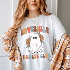 Our retro-inspired Invisible Illness Club shirt is complete with a groovy ghost and psychedelic flowers! It's the perfect blend of vintage vibes and modern awareness. The relaxed fit provides extra movement and comfort for those who may have nerve or skin sensitivities due to illness. Try sizing up for an oversized fit! This shirt is comfortable enough to sleep in. * 100% ring-spun cotton- preshrunk fabric * Fabric weight: 6.1 oz/yd² (206.8 g/m²) * Garment-dyed * Unisex relaxed fit * 7/8″ double Groovy Ghost, Fatigue Syndrome, Comfort Colors Shirt, Club Shirts, Migraine, Honduras