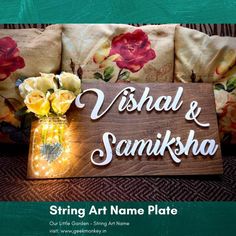 a wooden sign that says, wish and samksha string art name plate with flowers in a mason jar