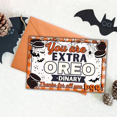 an orange and black halloween card with the words you are extra oreo on it