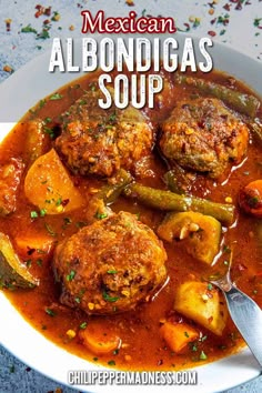 mexican albondigas soup with potatoes and green beans in a white bowl