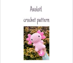 a pink crocheted teddy bear sitting on top of a green bush with the words axolot crochet pattern above it