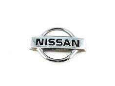 the nissan logo is shown on a white background and it appears to be made out of metal