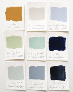 six different shades of blue, green, and yellow paint on white paper with the names of each color