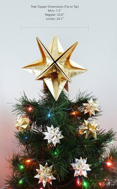 a christmas tree decorated with gold and white stars