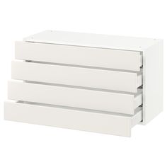 three white drawers stacked on top of each other