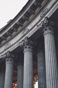 an old building with four large columns