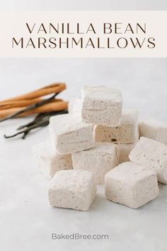 vanilla bean marshmallows stacked on top of each other with cinnamon sticks in the background