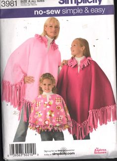 two girls wearing ponchles and capes on the cover of a sewing pattern