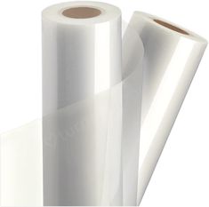 two rolls of white plastic wrapper sitting next to each other