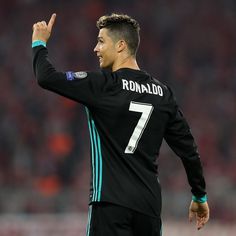 ronaldo waves to the crowd as he walks on the field