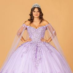 The Excellent Princess Dress Made Of Mesh Is Decorated With Delicate Floral Appliques And Sparkling Beads. This Product Is Complemented By A Mesh Cape That Creates A Truly Magical Image. Fabric: Mesh Length: Long Colour: Lilac Neckline: Off Shoulder Silhouette: Ball Gown Sleeve: Sleeveless Back: Semi Open Back Is Laced Up, Zipper Skirt: Layered Embellishments: Butterfly Applique, Beads, Glitter Occasion: Romantic Date/Evening/Dinner, Wedding/Bridesmaid, Graduation, Fashion Show, Visiting Theater Lilac Quinceanera, Lilac Quinceanera Dresses, Purple Tulle Dress, Graduation Fashion, Gown With Cape, Detachable Cape, Butterfly Applique, Bedtime Prayer, Evening Dinner